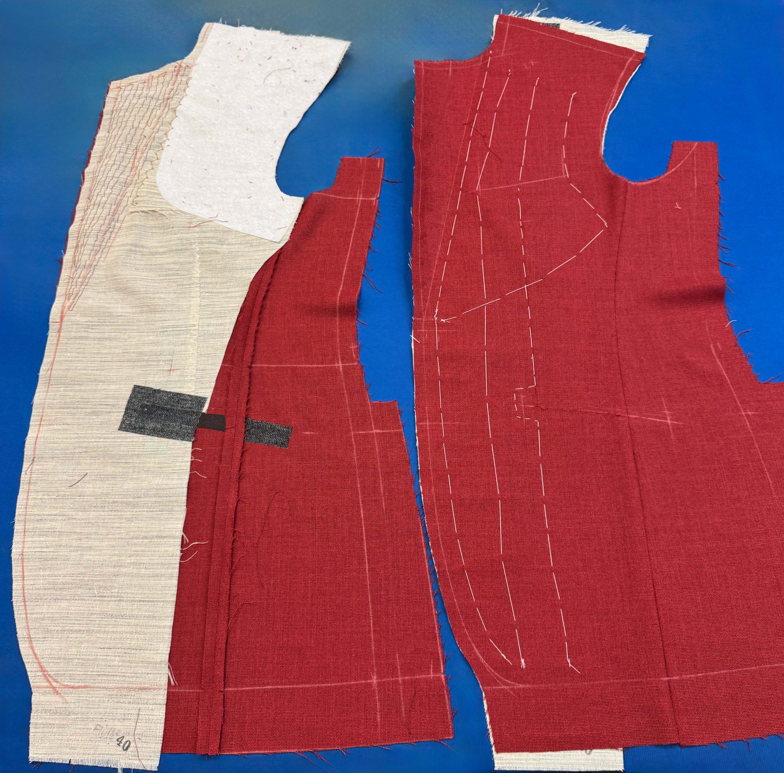 Bhambi's master tailor hand-sewing a bespoke suit in the New York City workshop – custom menswear crafted in Midtown Manhattan